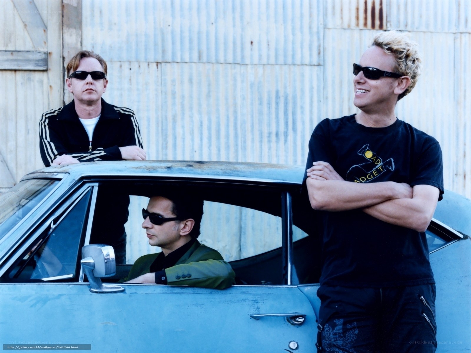 three men with sunglasses by car