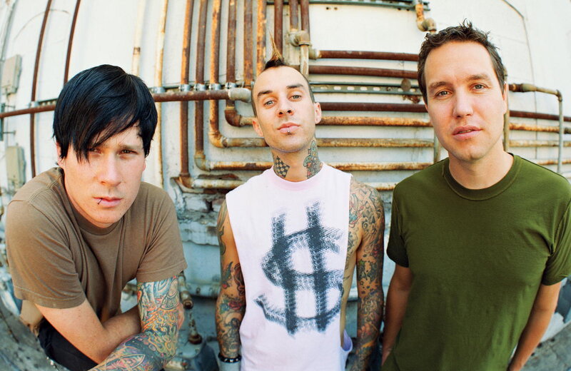 three men with tattoos posing