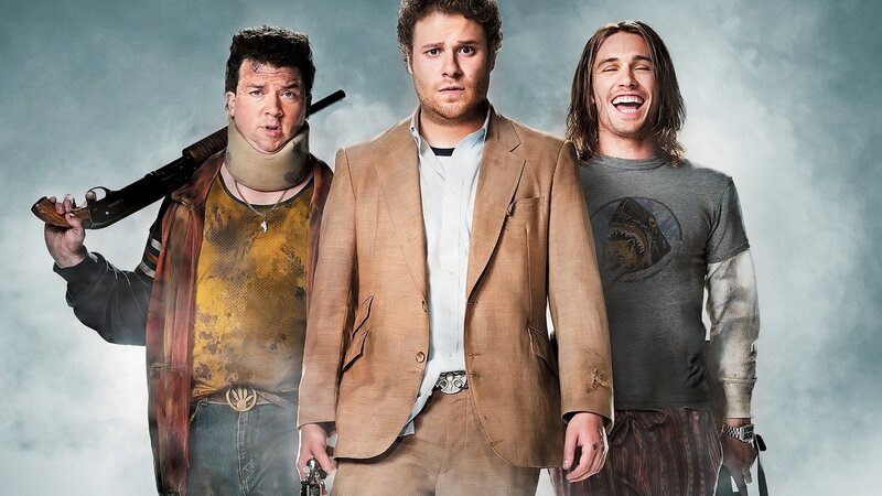 Three men with weapons in a smoky scene