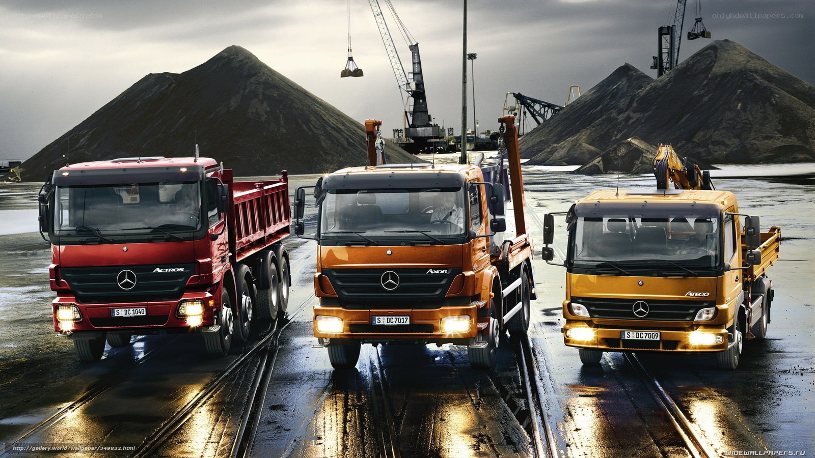 Three Mercedes-Benz trucks in a quarry