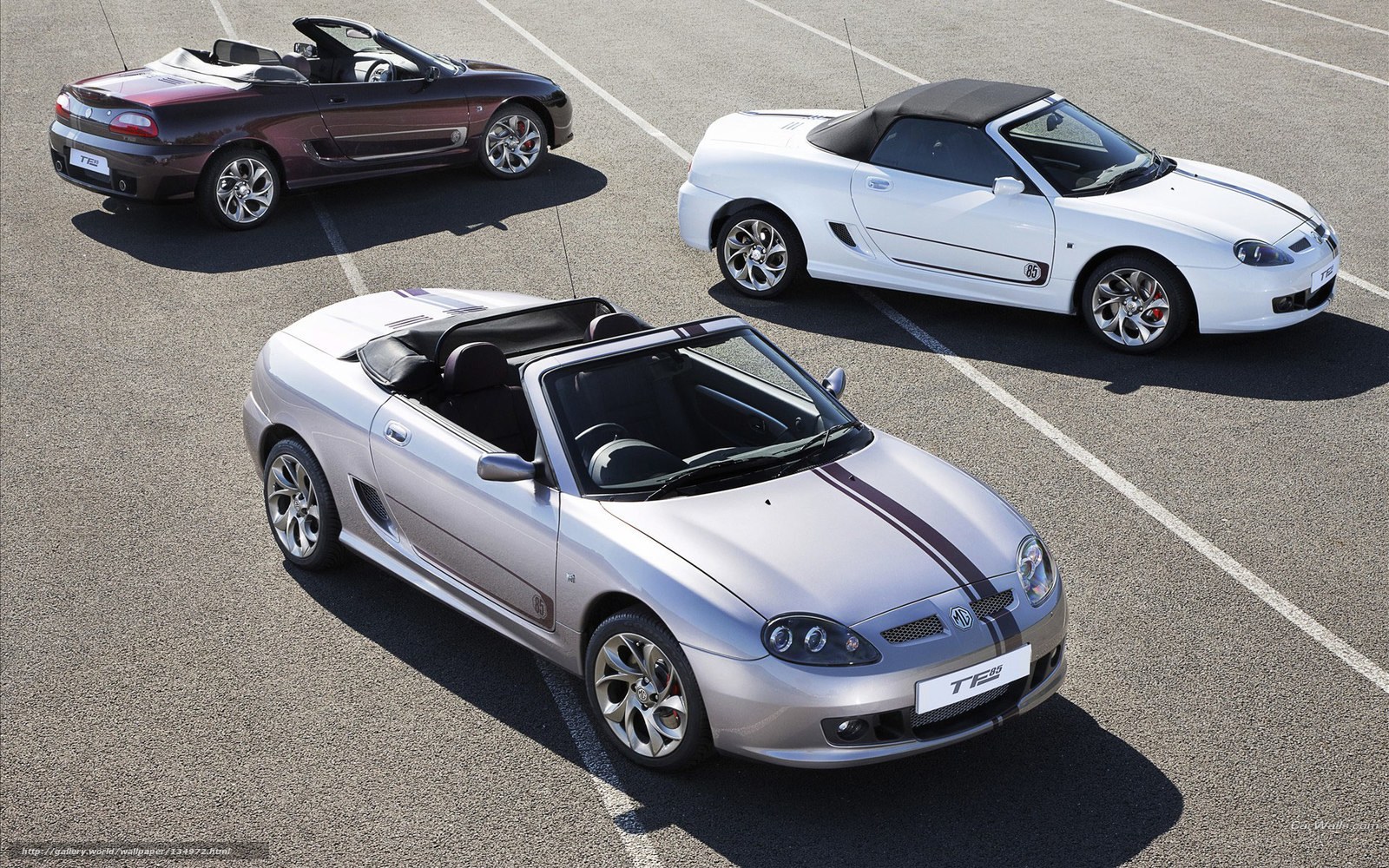 Three MG TF sports cars