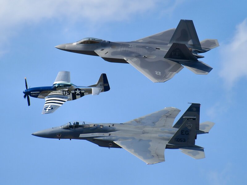 Three military aircraft in flight