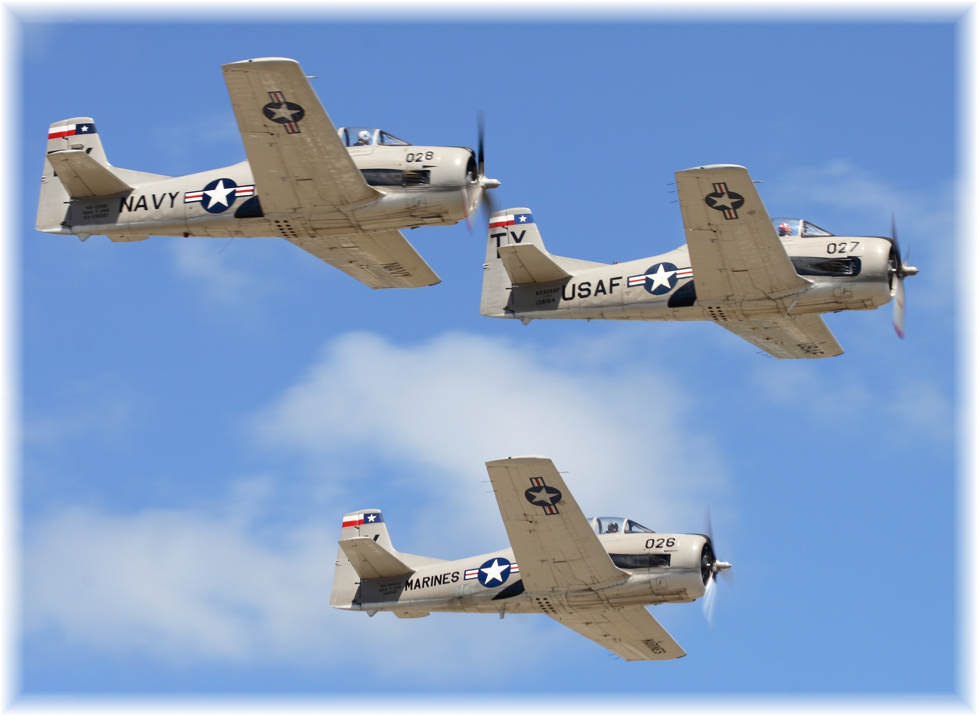 Three military aircraft in formation