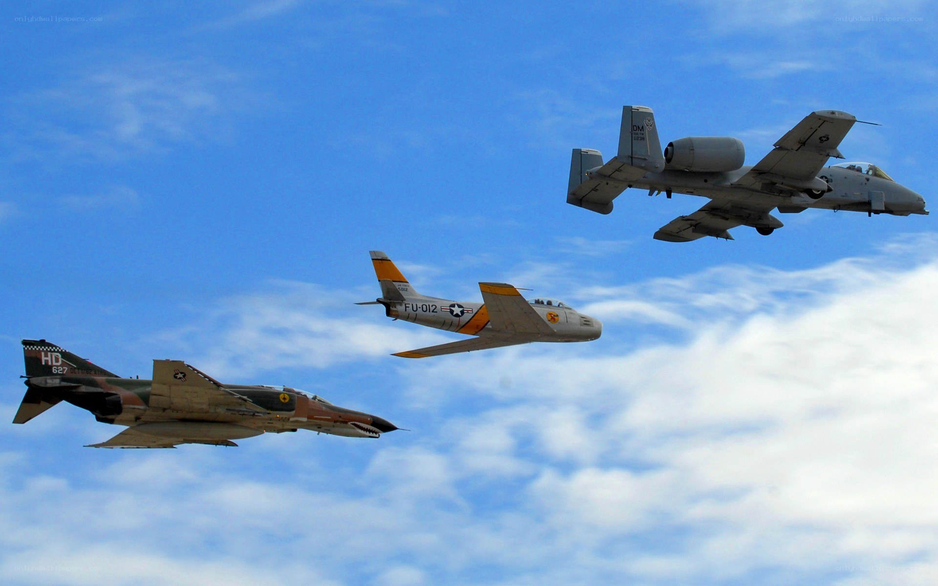 Three military jets in formation