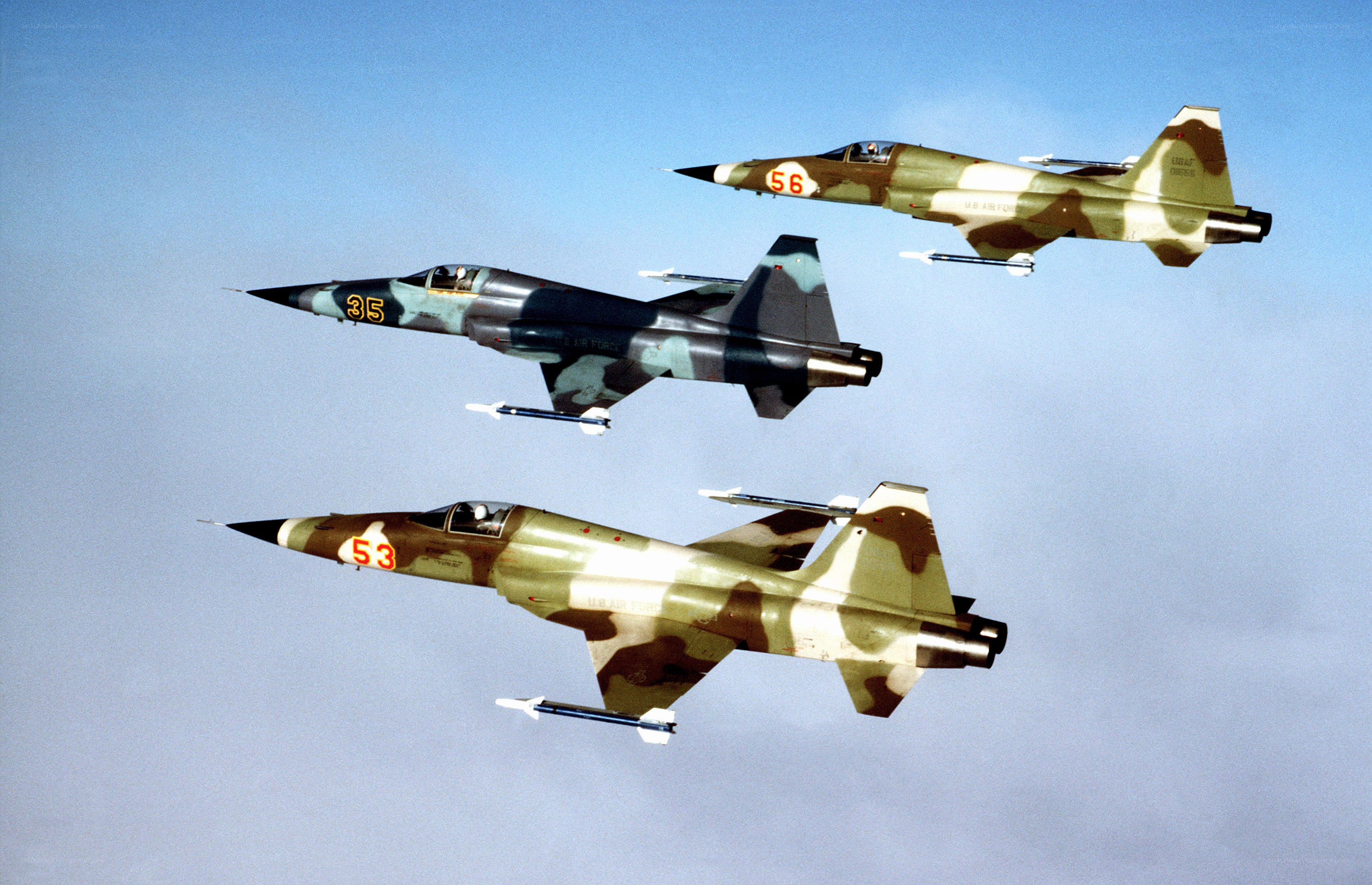 Three military jets in formation