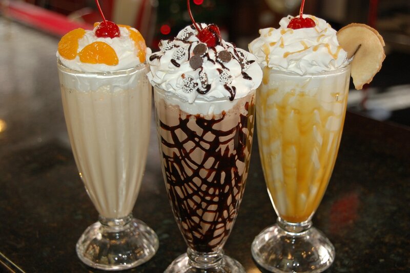 Three Milkshakes in Glasses