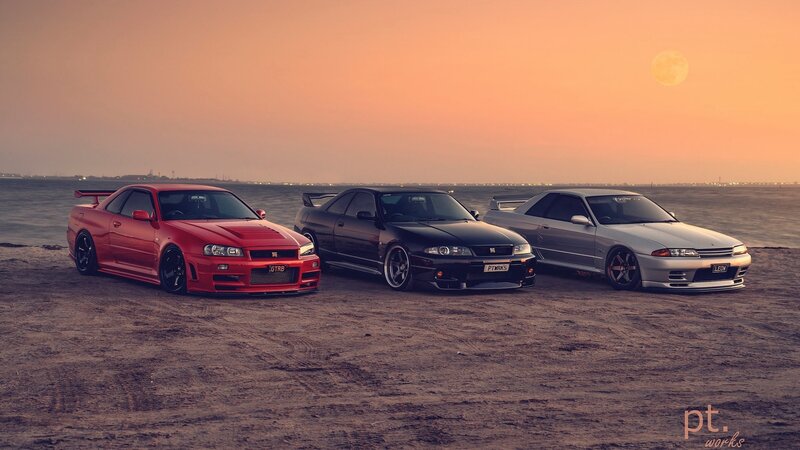 Three Modified Cars on Beach