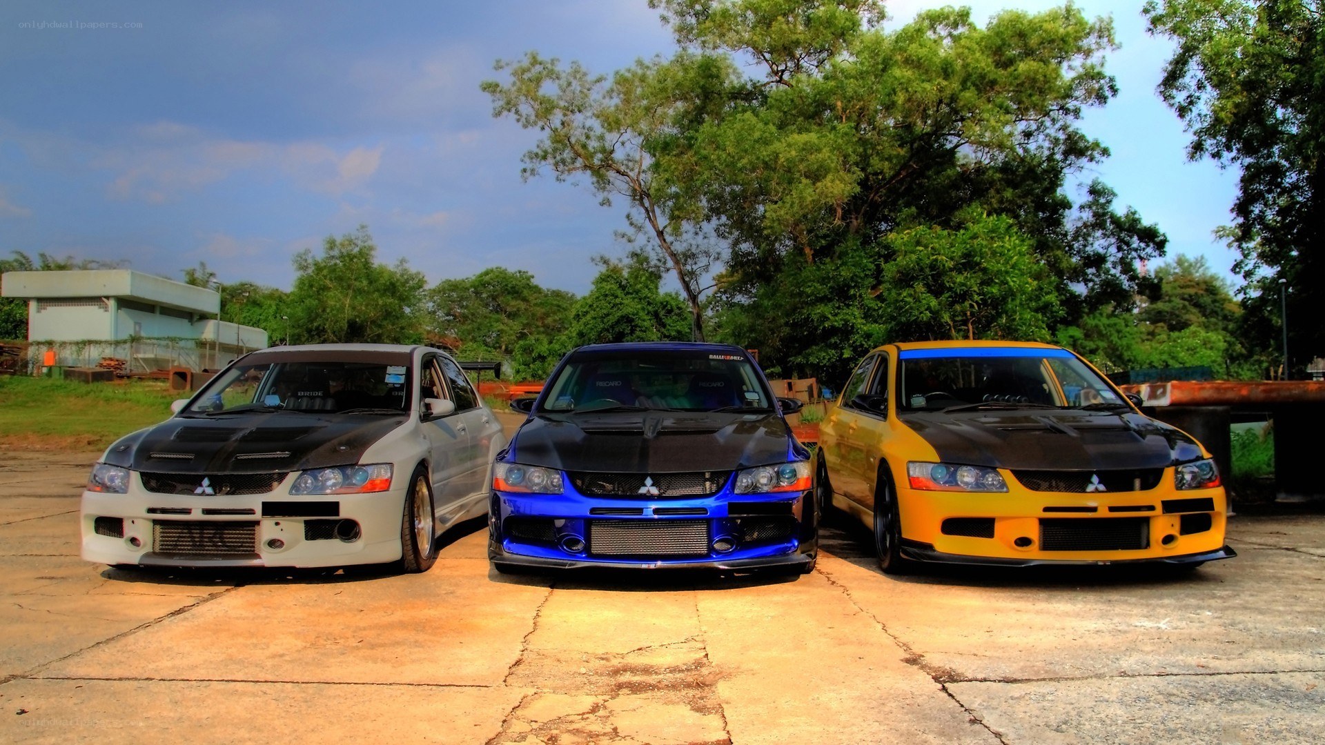 Three modified Mitsubishi Lancers