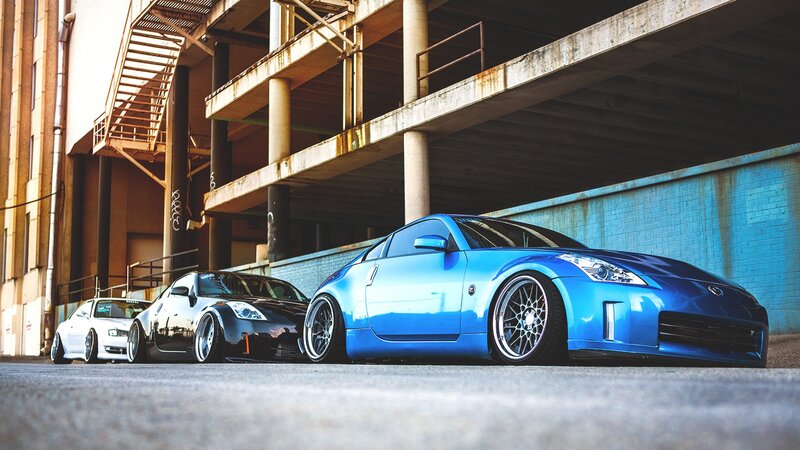three modified sports cars