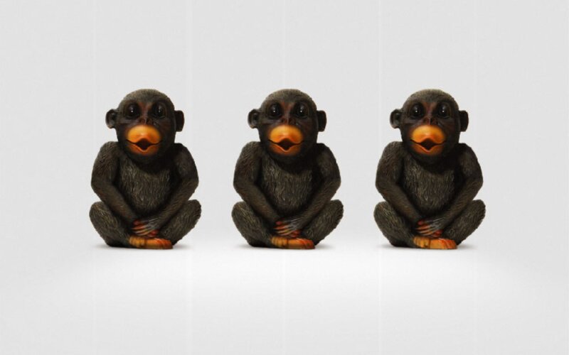 three monkey figurines