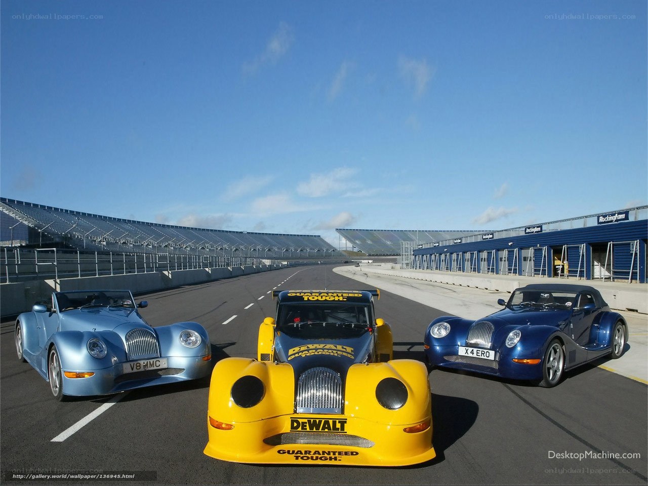 Three Morgan cars on a racetrack
