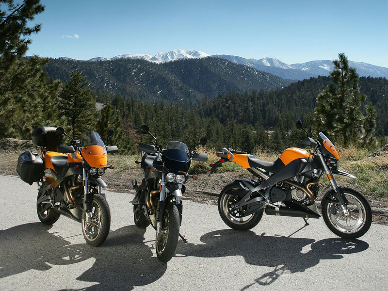 Three motorcycles on a mountain road