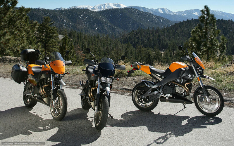Three motorcycles on a mountain road