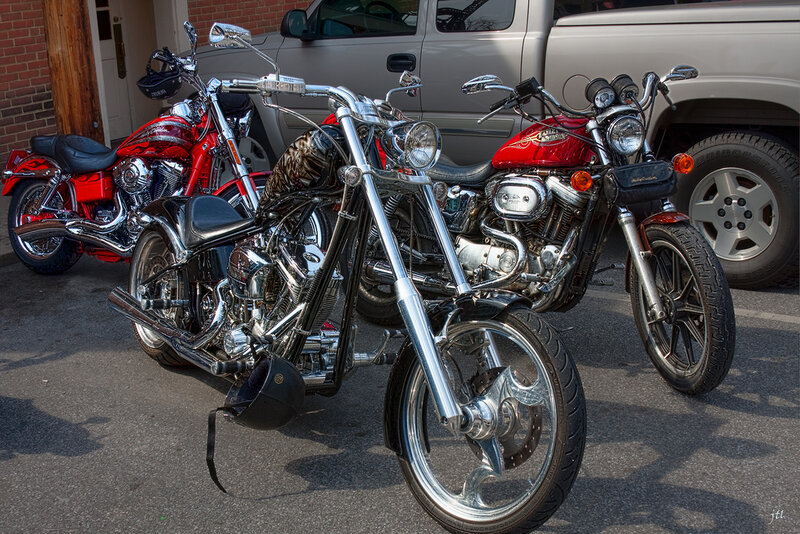 Three Motorcycles Parked — Red