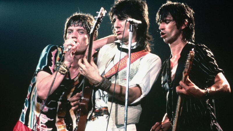 Three Musicians on Stage — Black, Energetic, Night