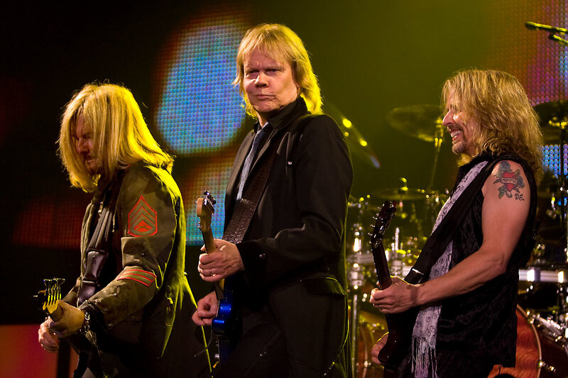 Three Musicians on Stage — Black, Energetic