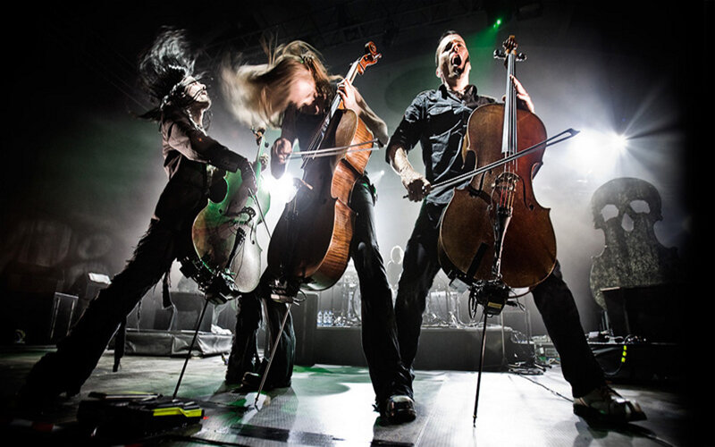 Three Musicians Playing Cellos