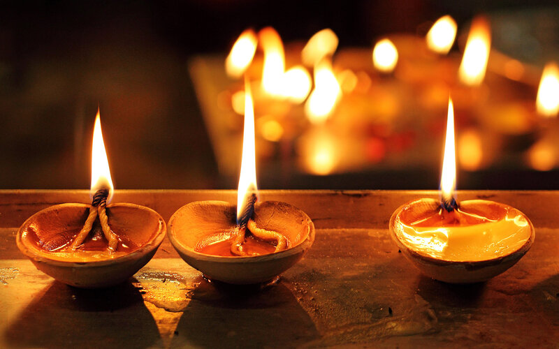Three Oil Lamps Burning
