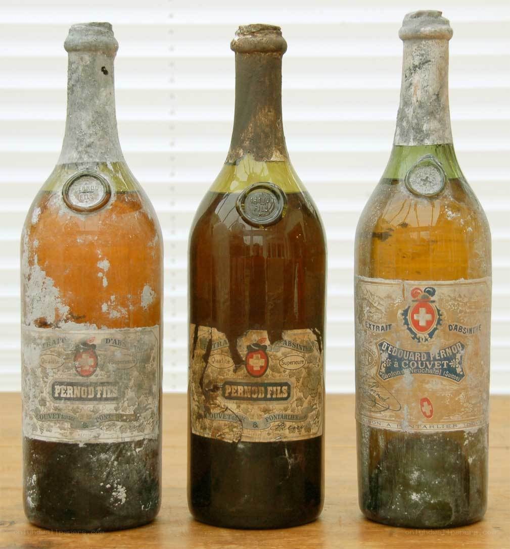 Three old Pernod Fils bottles