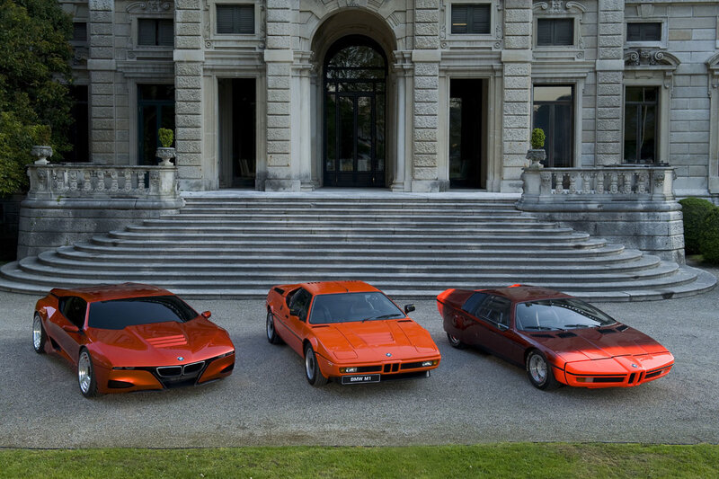 Three Orange BMW M1 Cars