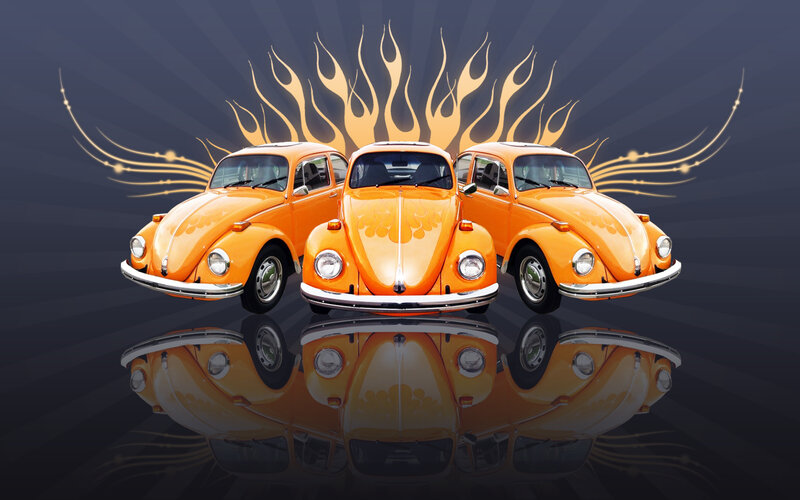 Three Orange Volkswagen Beetles