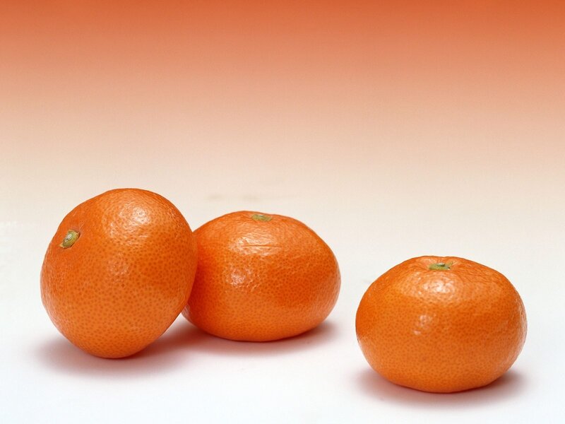 Three oranges on white background
