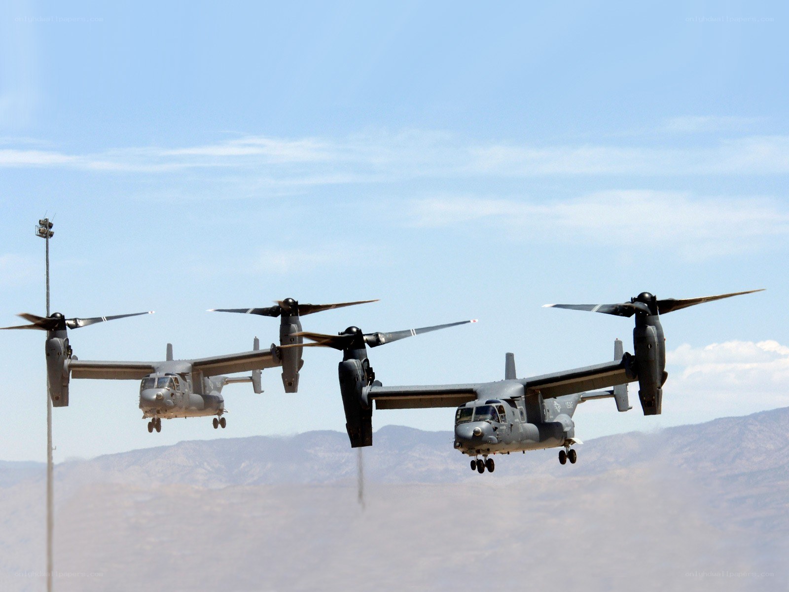 Three Osprey aircraft in formation
