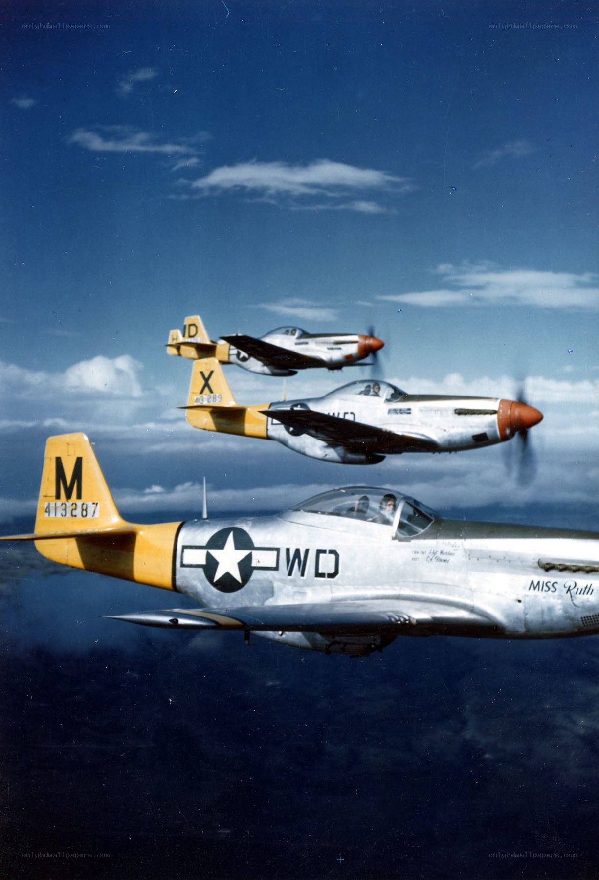 Three P-51 Mustangs in formation