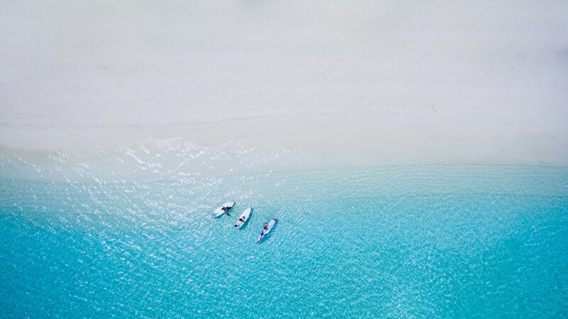 Three Paddleboarders in Ocean