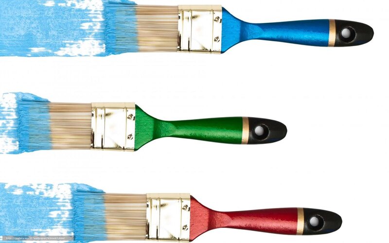 Three paintbrushes with blue paint
