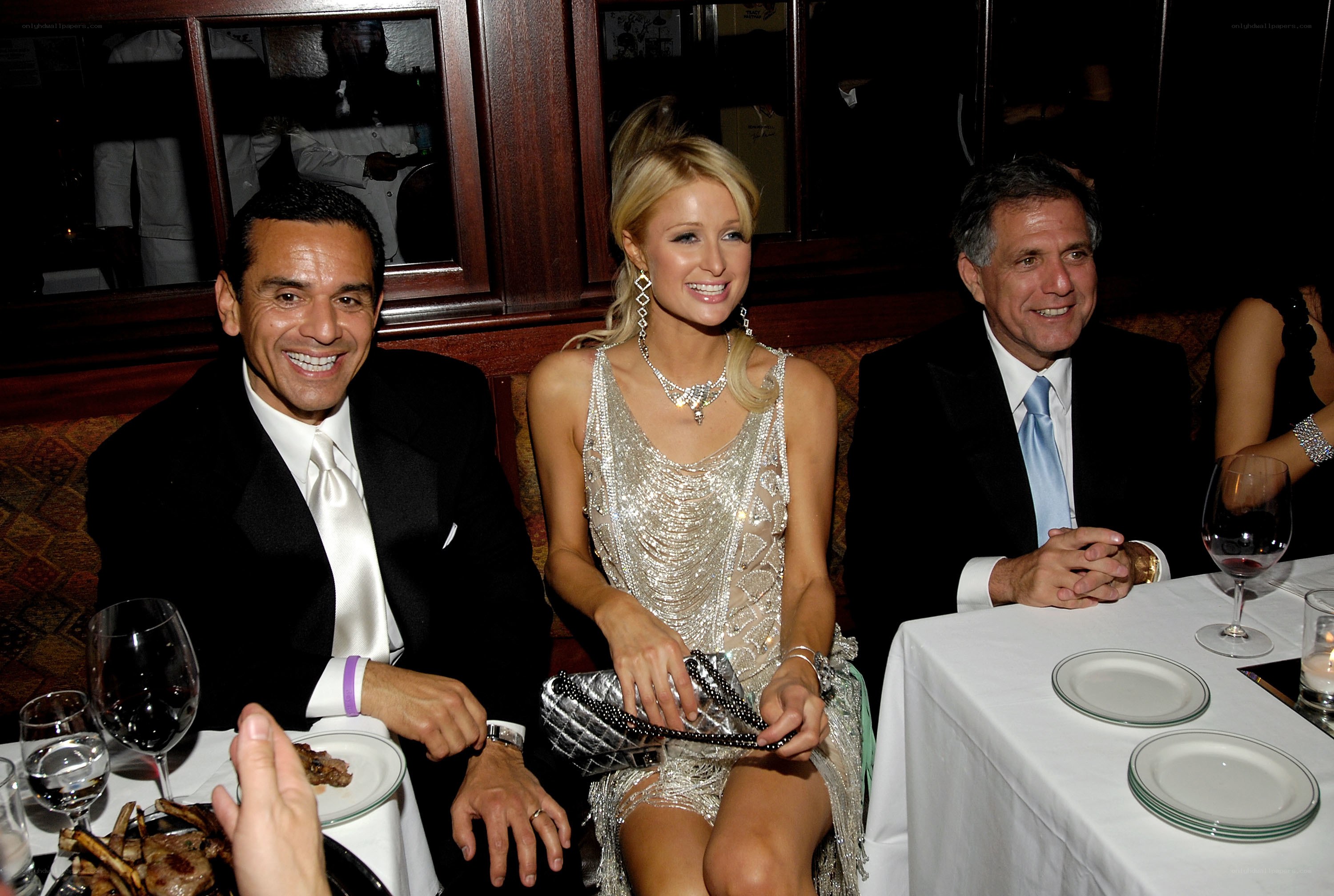 Three people at a dinner table
