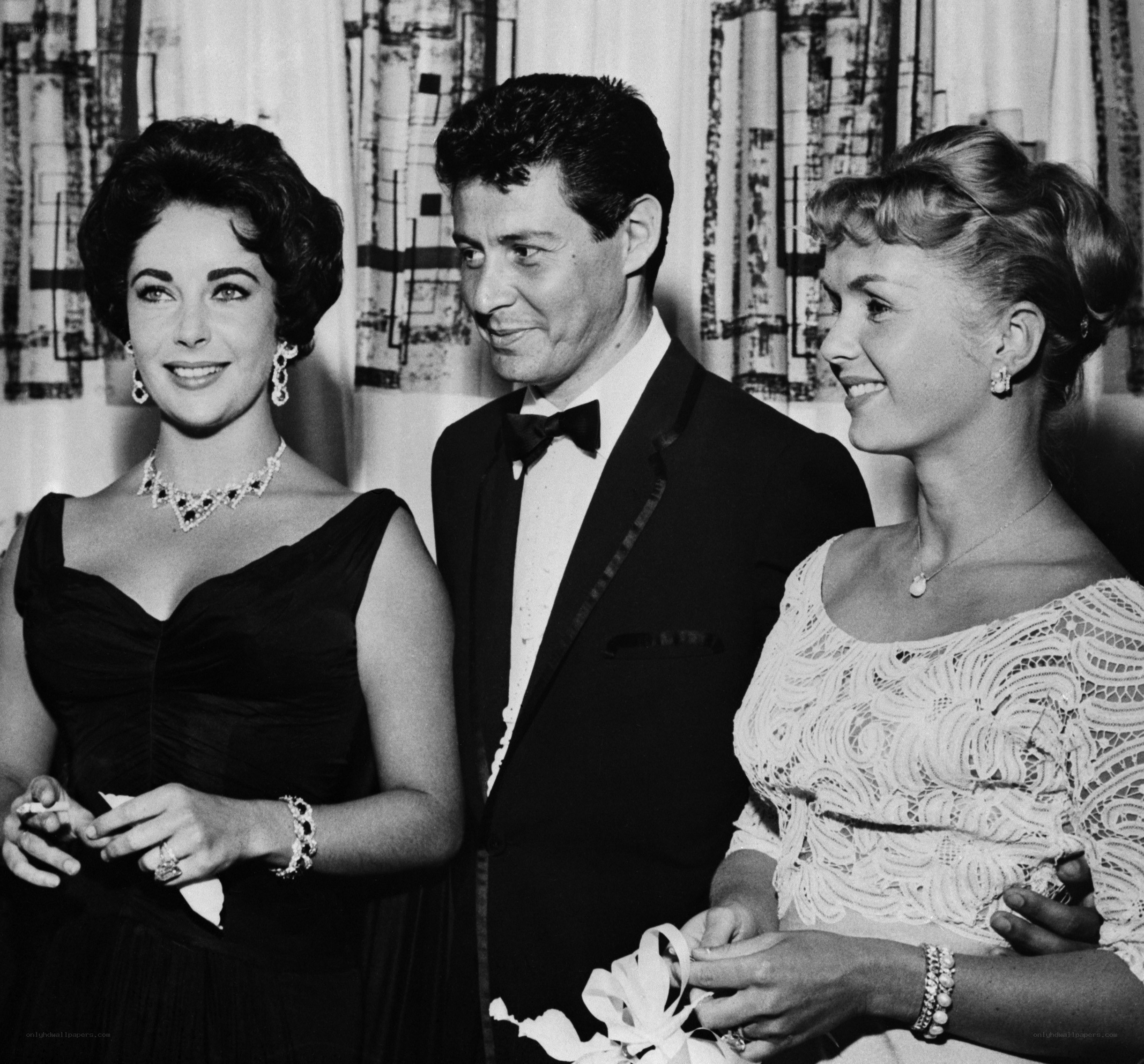 Three people at a formal event