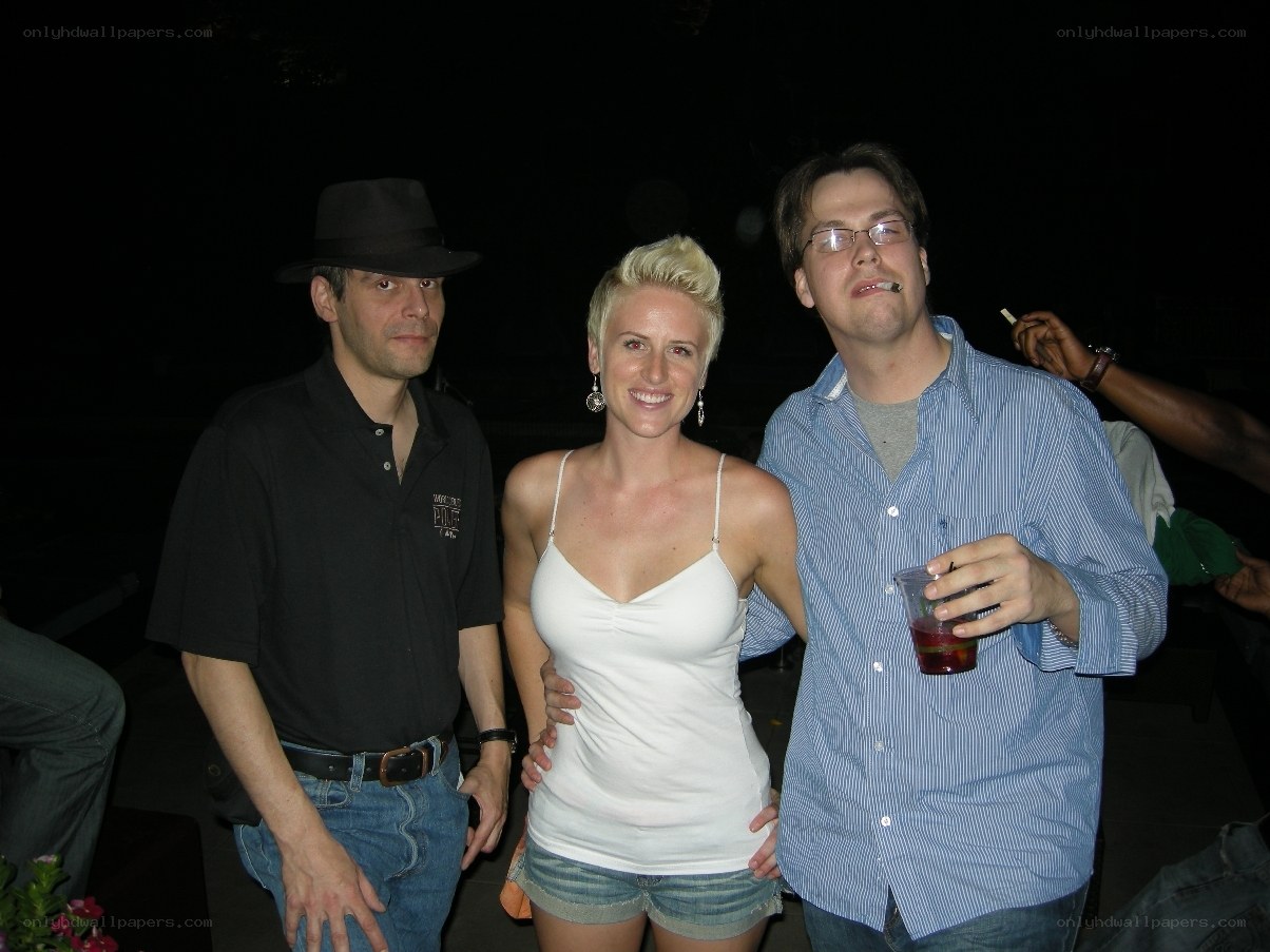 Three people at a nighttime gathering