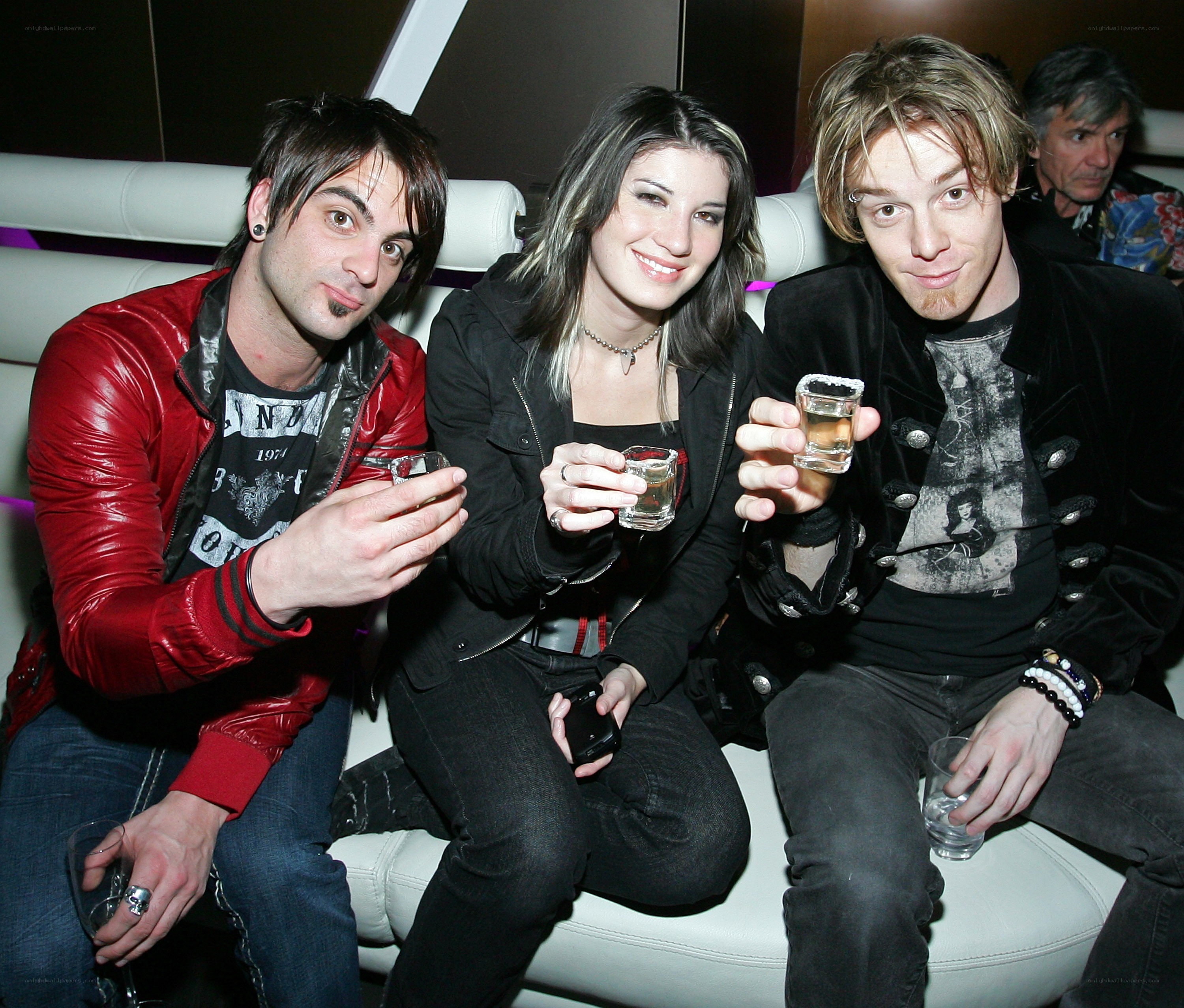 Three people at a party with drinks