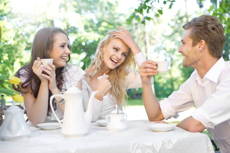 Three People at Tea Table