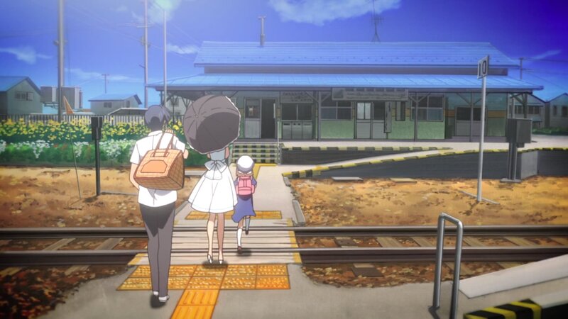 Three People at Train Station