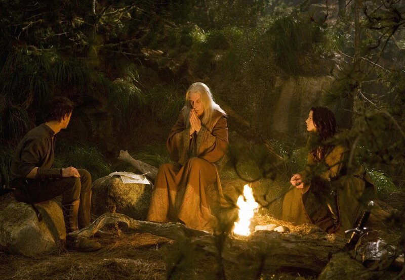 Three People by Campfire