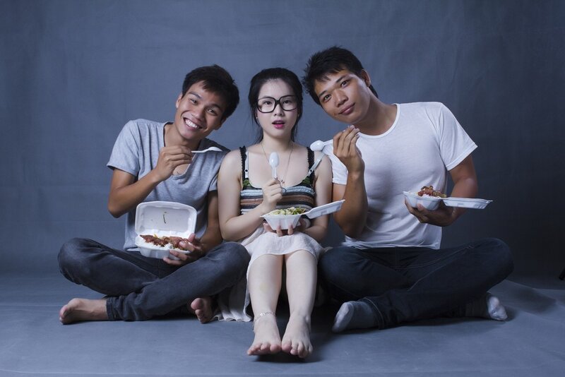 Three People Eating Food