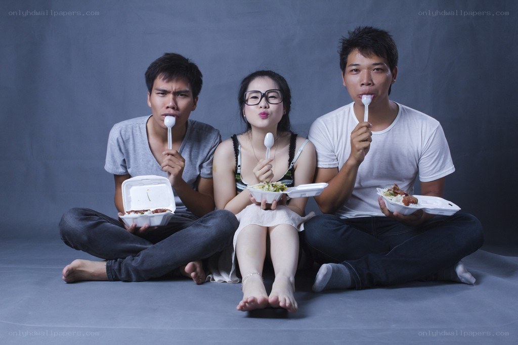 Three people eating takeout