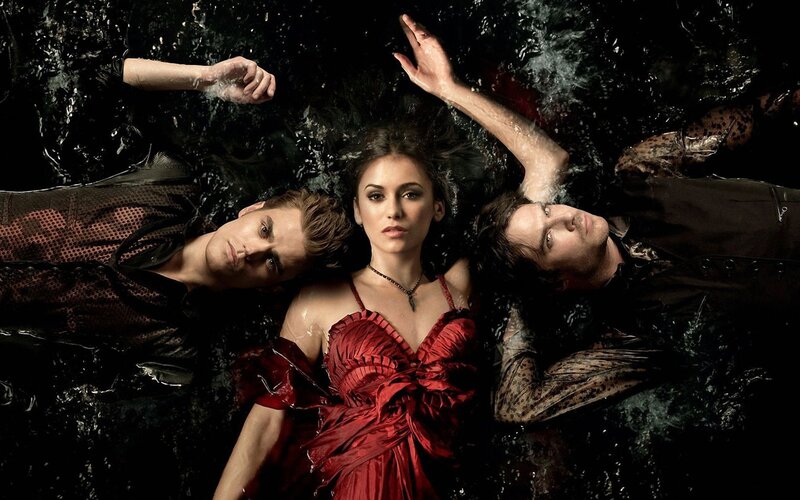 three people floating in water