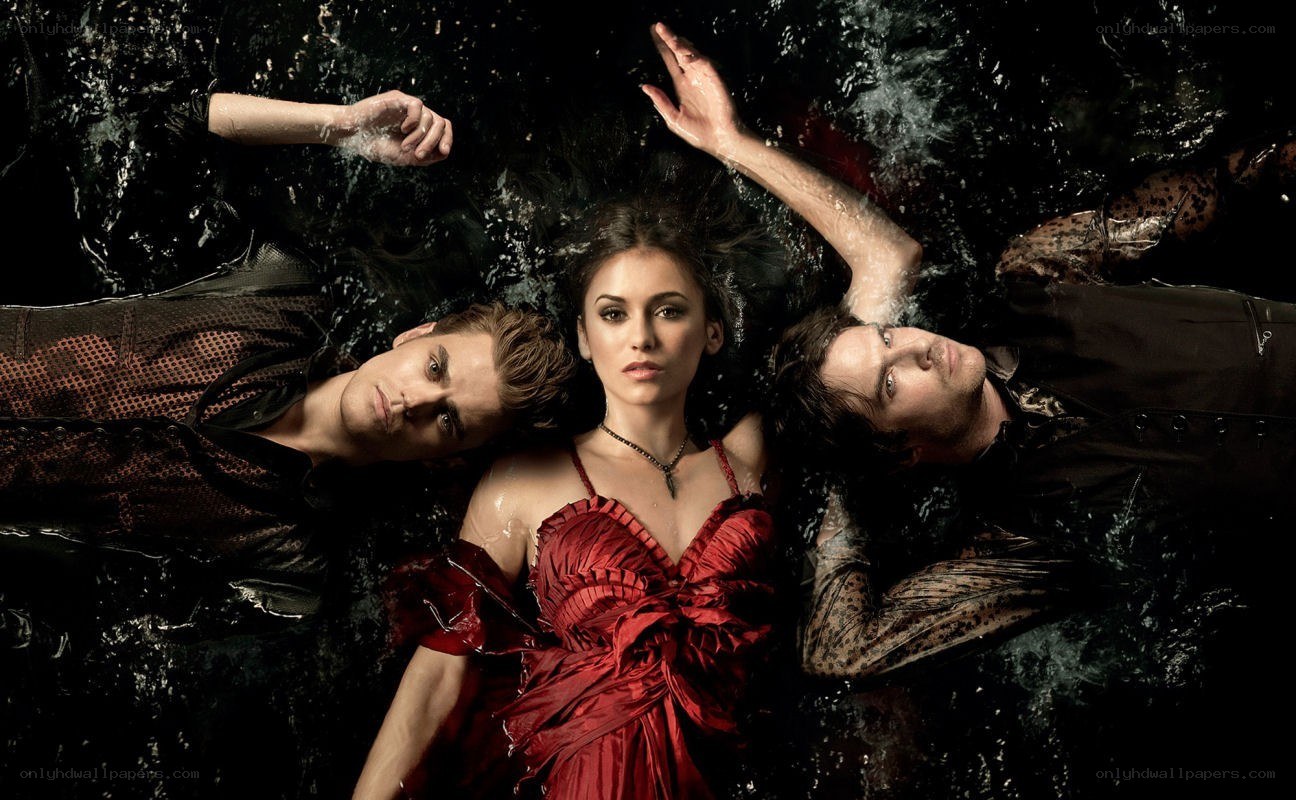 three people floating in water