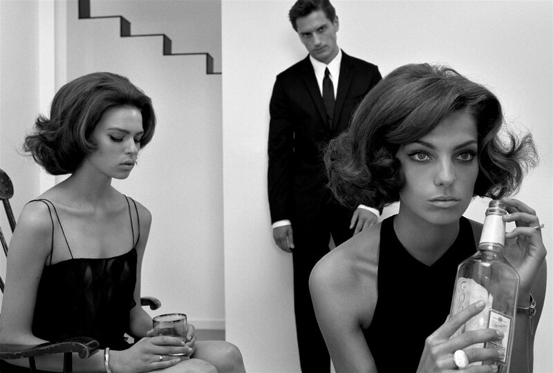 Three people in a black and white photo