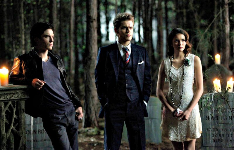 Three People in a Cemetery