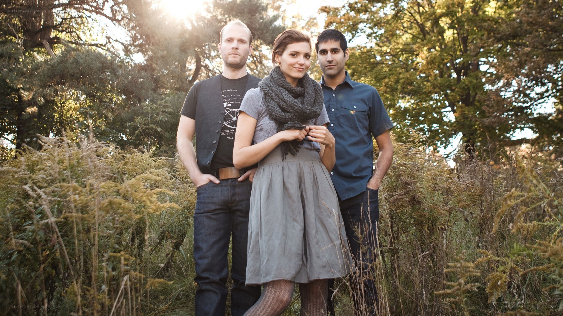 three people in a field