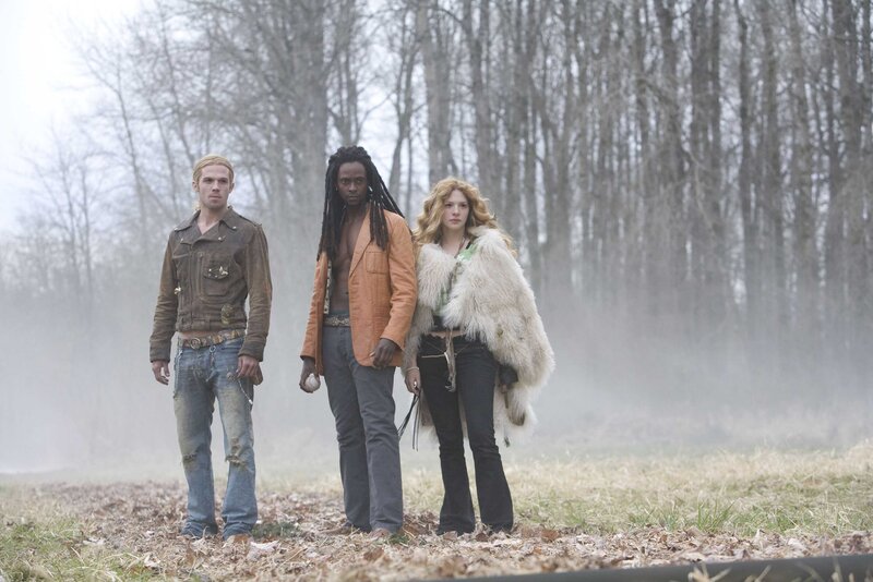 Three People in a Field — Gray