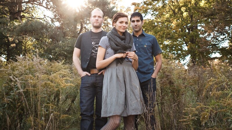 three people in a field