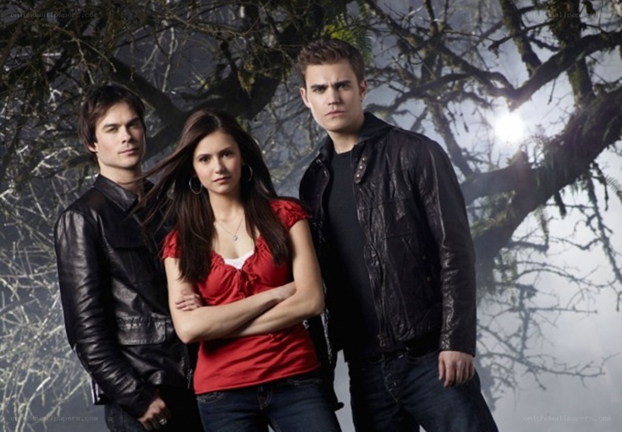 three people in a forest