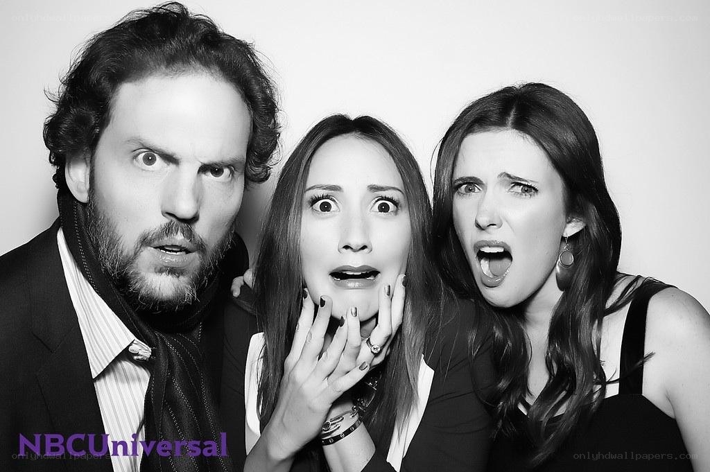 three people in a photo booth