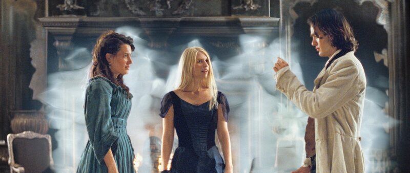 Three people in a room with smoke