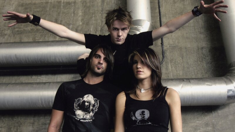 Three People in Black Shirts